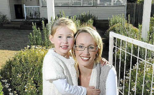Emily Barnes cuddles up with daughter Olivia at their new family home quickly snapped up before the State Government cuts its stamp duty concession on Monday. Emily Barnes cuddles up with daughter Olivia at their new family home quickly snapped up before the State Government cuts its stamp duty concession on Monday.